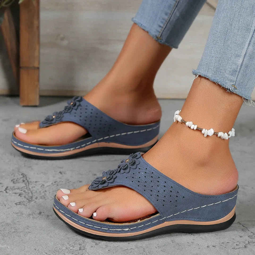 Women's orthopedic flip flop sandals with 3D floral appliqué strap and cushioned ergonomic sole