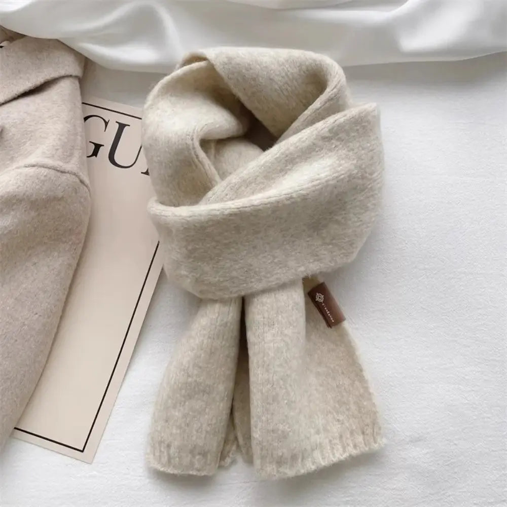 Chloé soft wool winter scarf in elegant neutral tone, lightweight luxurious women's accessory