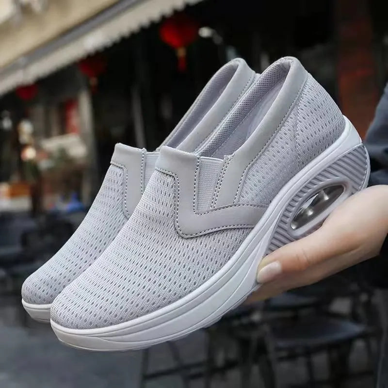 Lightweight women's sneakers in neutral tones, slip-on casual style with all-day cushioned support