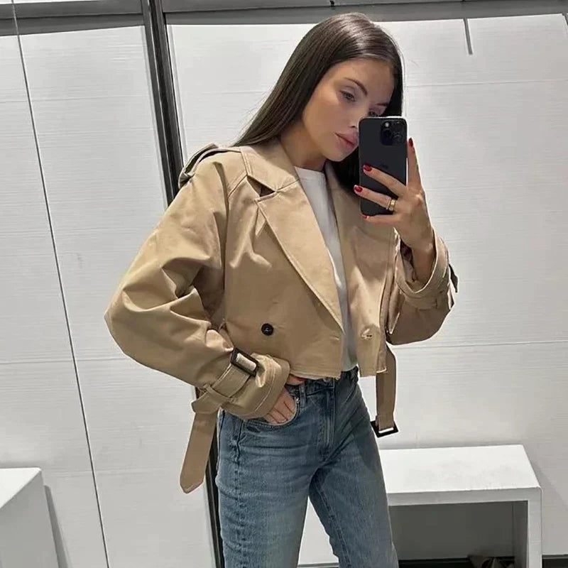 Women's short trench coat with double button placket, belted cuffs, modern chic silhouette