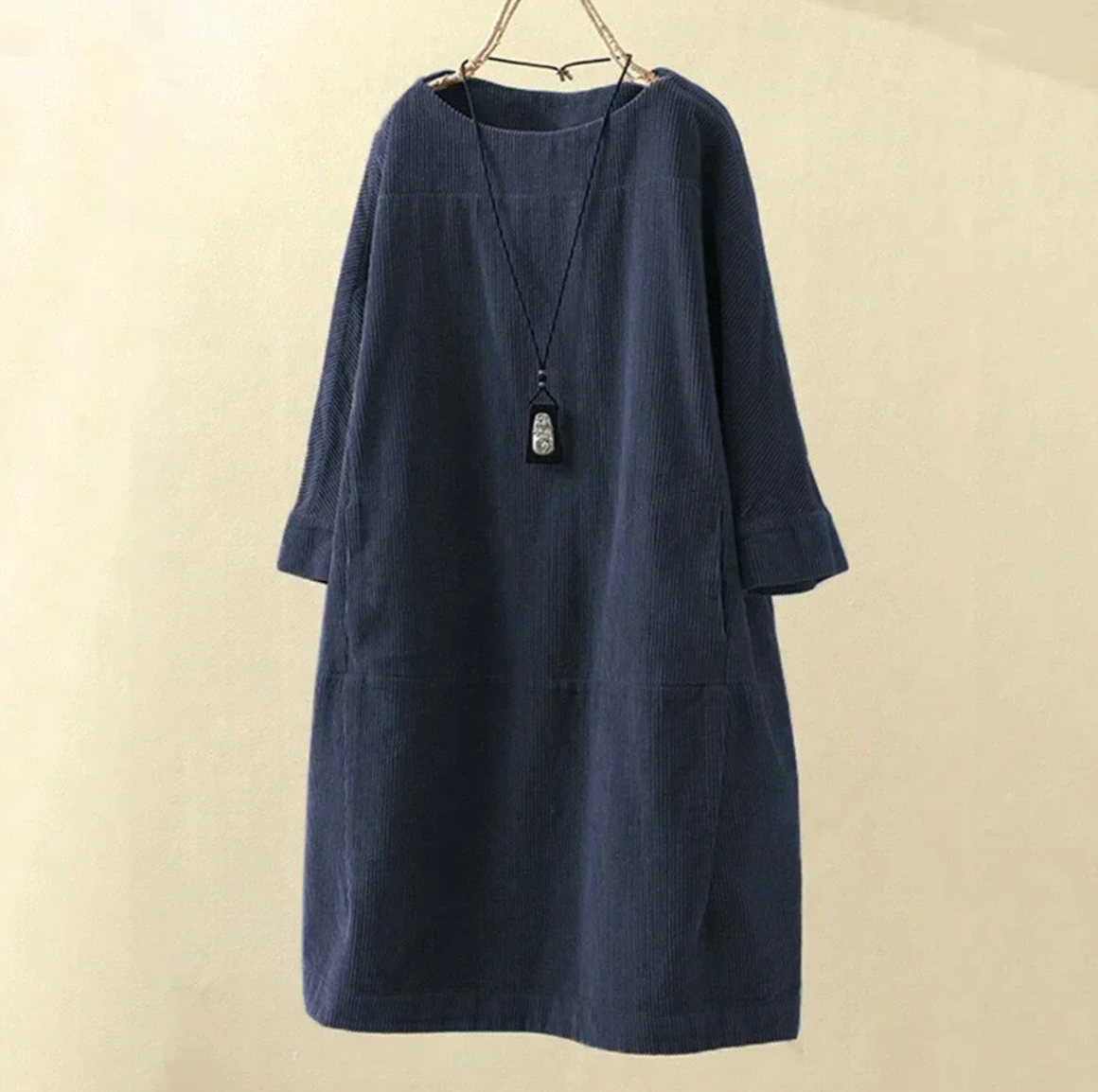 Women's burgundy corduroy midi dress with textured ribbed fabric and relaxed everyday silhouette