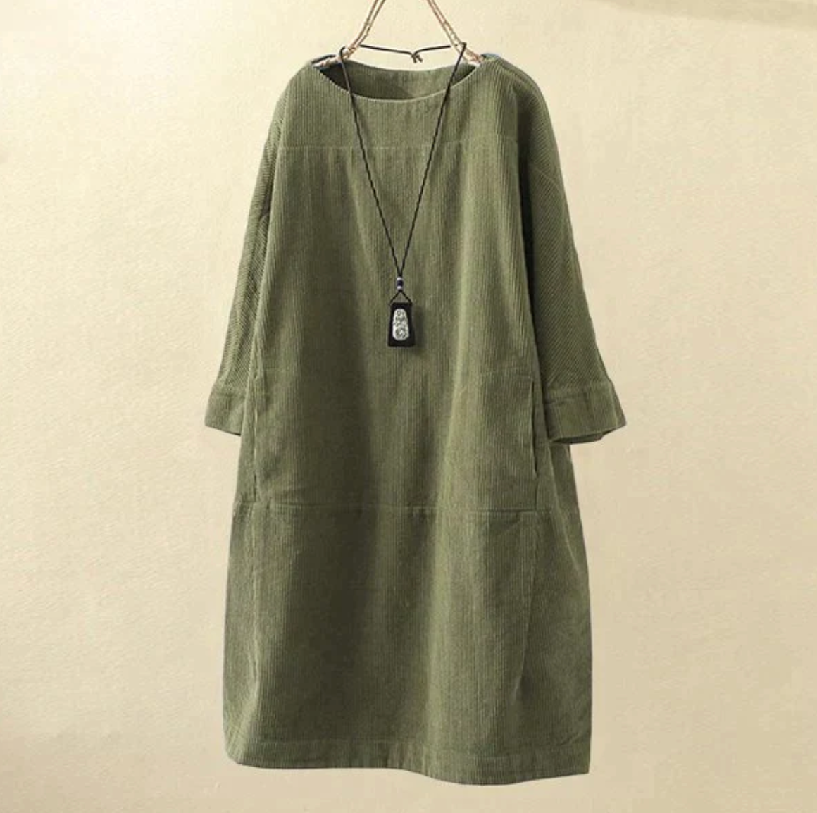 Women's brown corduroy midi dress with subtle textured finish and relaxed silhouette for versatile daywear