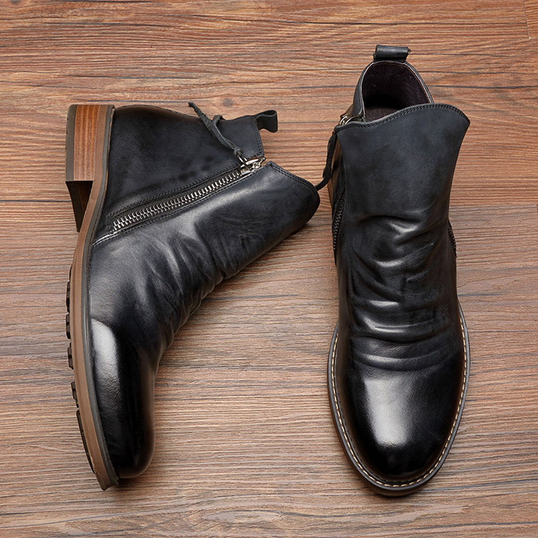 Men's black leather ankle boots with side zipper, sleek silhouette, easy zip access for all-day wear