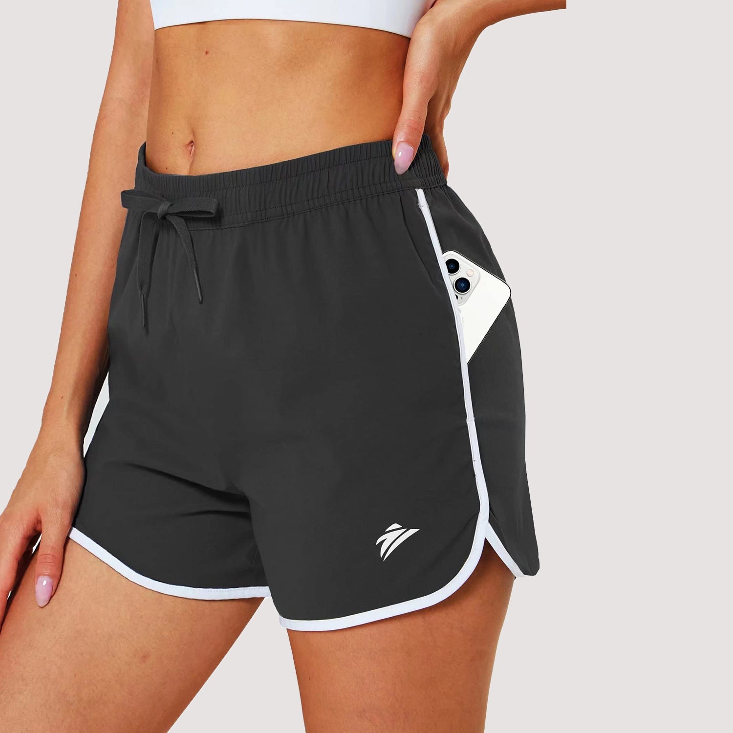 Women's black running shorts with 7-pocket design, quick-dry nylon-spandex blend, athletic fit for runners