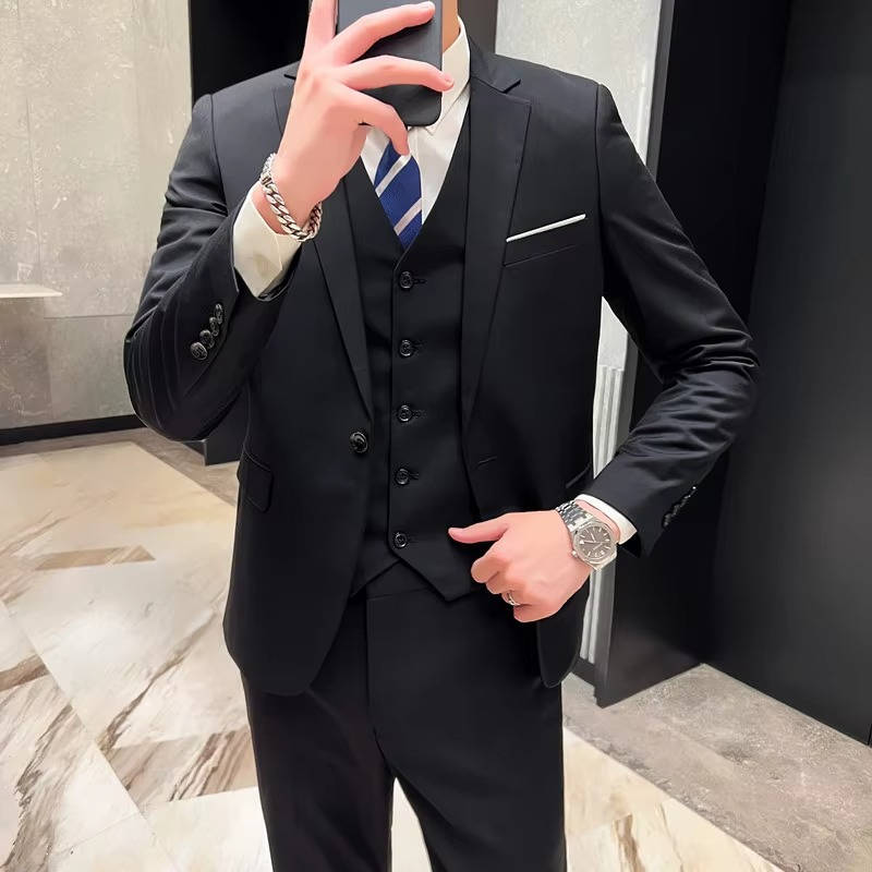 Men's slim fit three-piece suit in classic colors with matching jacket vest and pants for formal wear