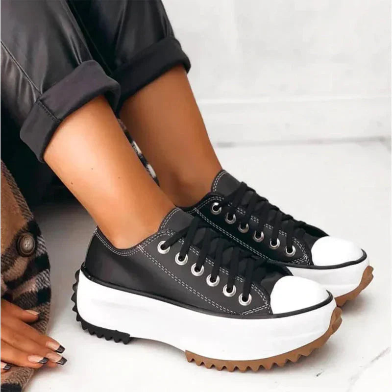 Women's white lace-up platform sneakers with chunky lug sole, low-cut silhouette for everyday style
