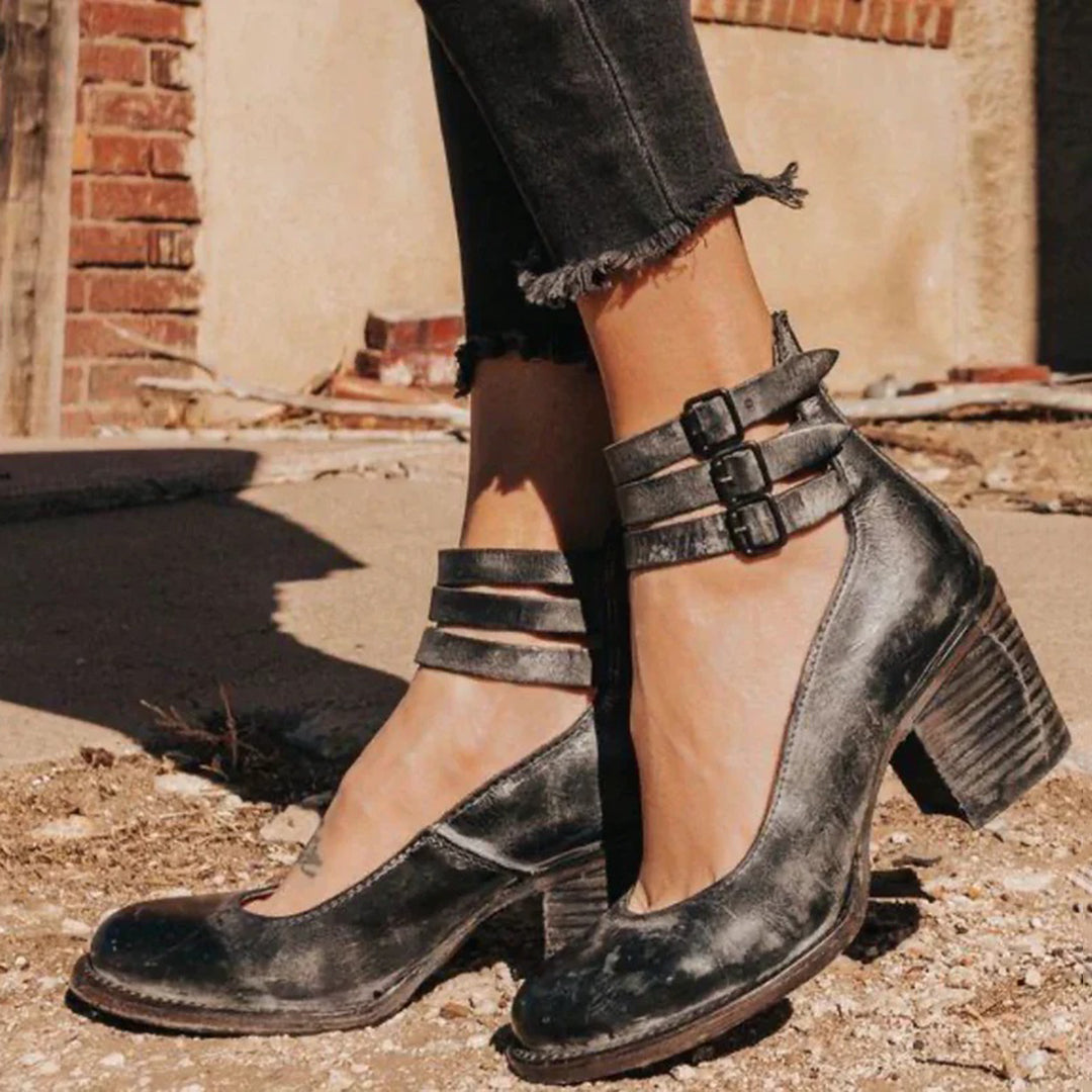 Women's closed toe block heel pumps in synthetic leather with adjustable ankle strap for all-day comfort