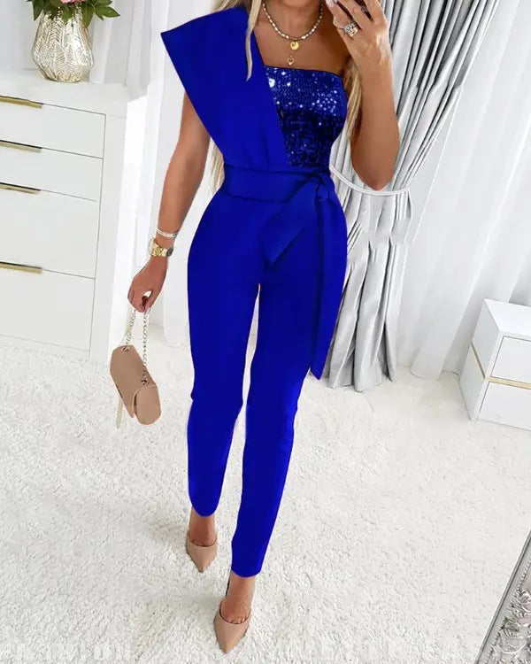 Women's silver sequin one-shoulder jumpsuit with stretch fit and shimmering asymmetrical neckline