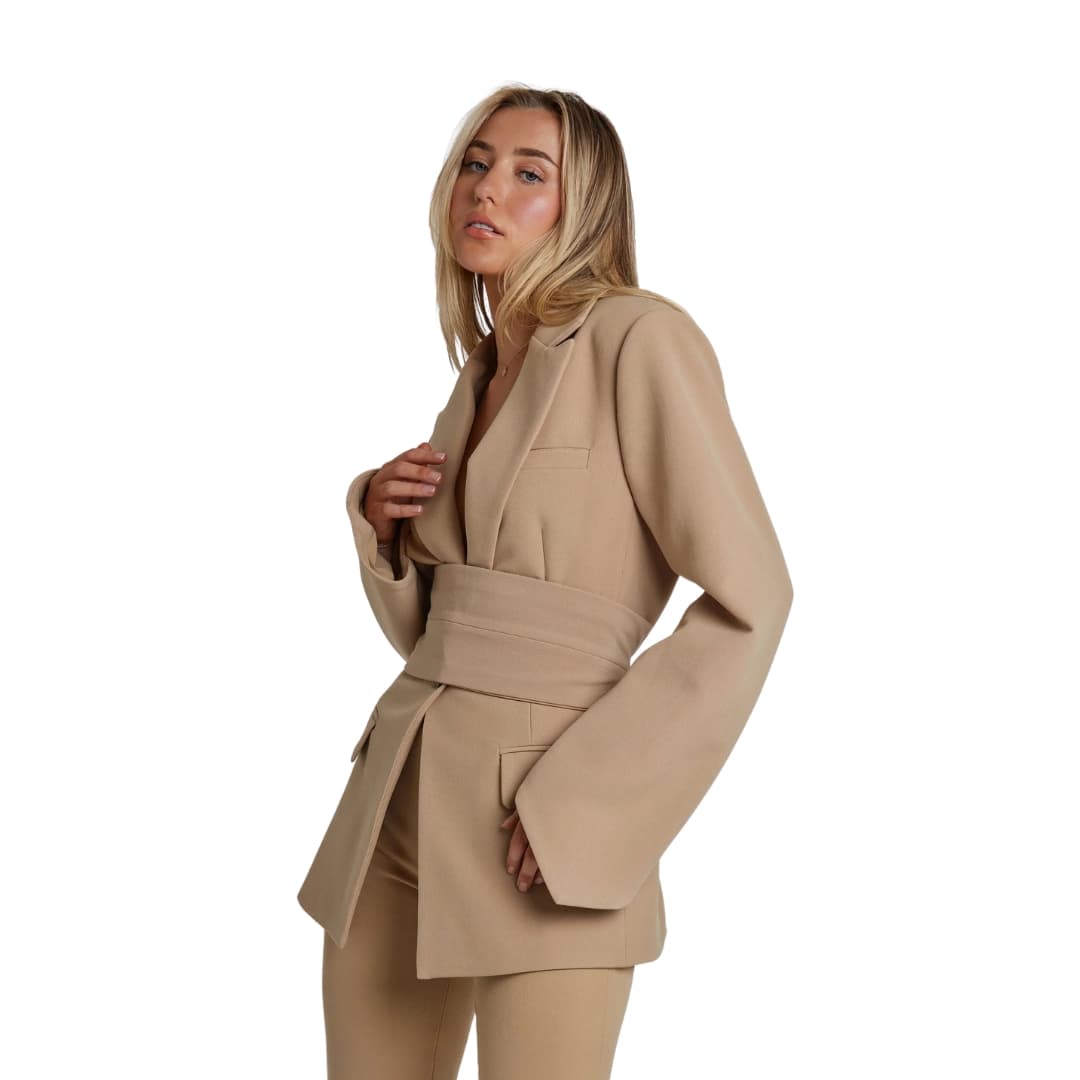 Women's structured blazer with belted waist, long sleeves, front pockets, and clean neckline for polished workwear