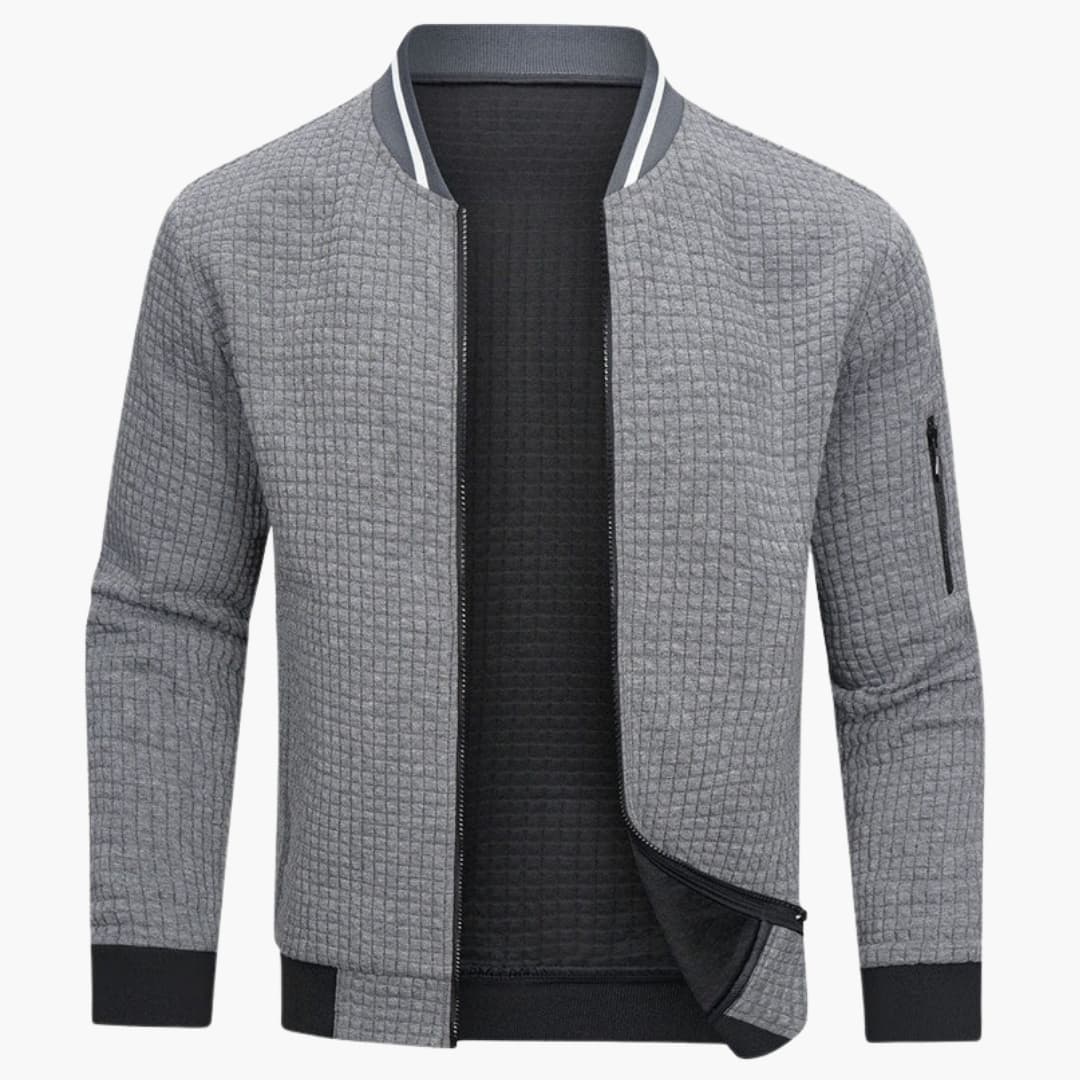 Men's quilted bomber jacket with ribbed hem, stand-up collar, and zippered sleeve pocket for daily wear