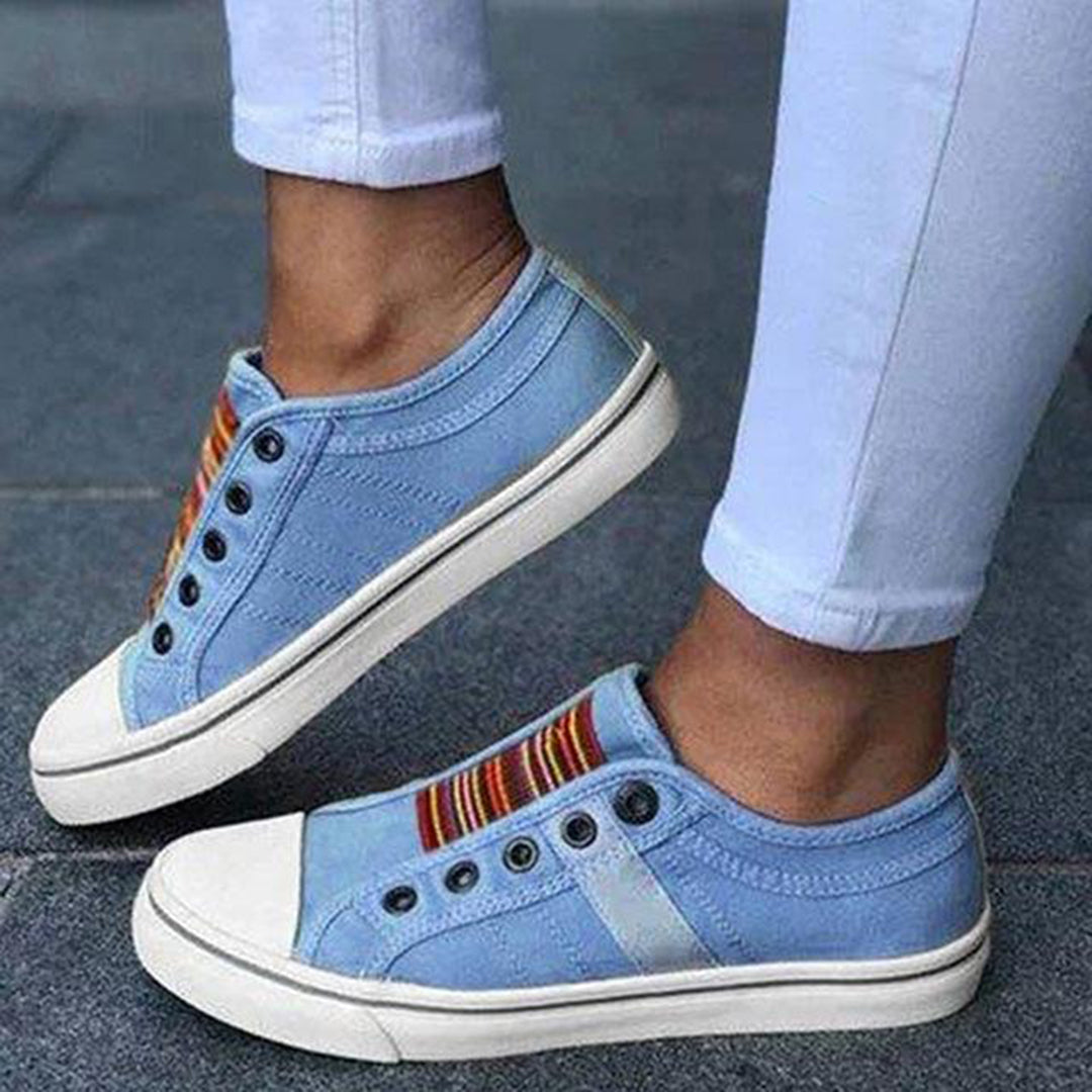 Mia women's white canvas slip-on sneakers with elastic detailing for effortless street style