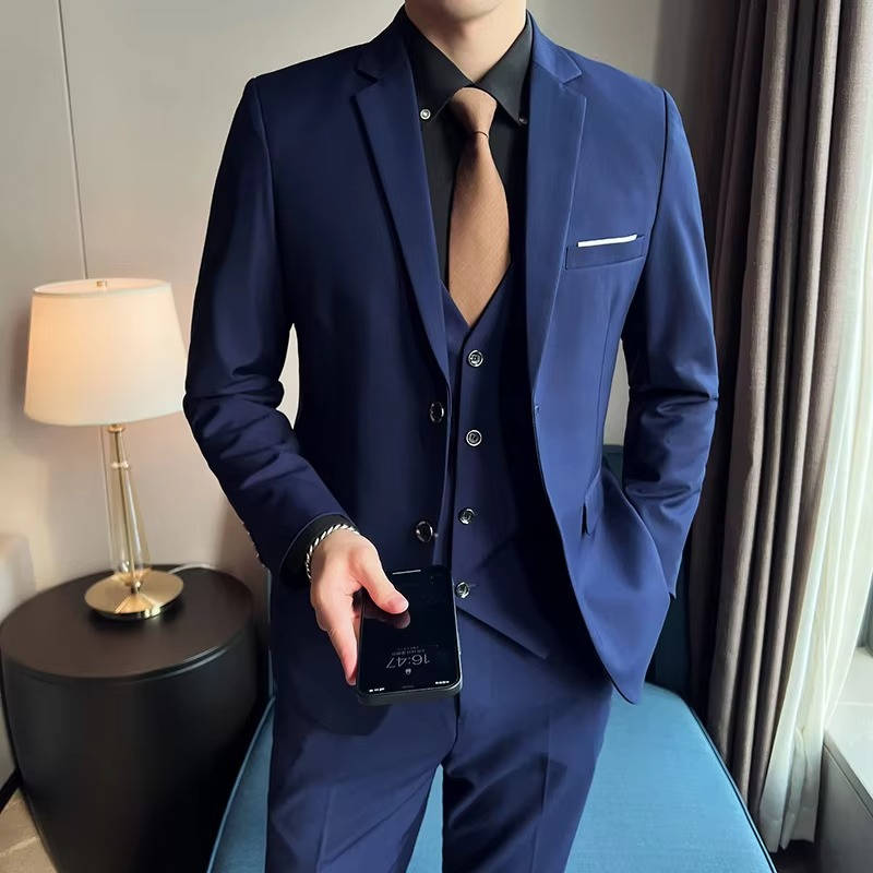 Men's slim fit three-piece suit in classic black with matching vest, jacket, and tailored pants