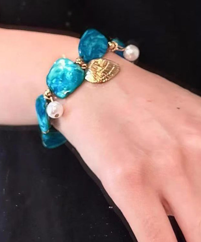 Bracelet à breloques asymétriques en alliage bleu bohème avec coquillages pour les fêtes - Urbann-Vibe
