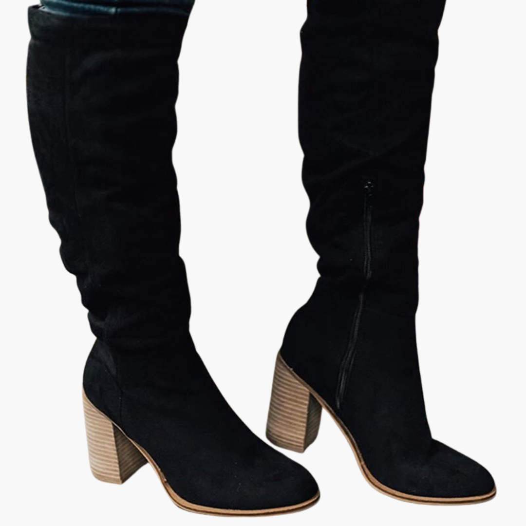 Women's black slouch knee-high boots with structured block heel and relaxed pull-on shaft