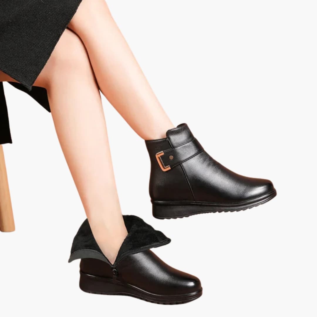 Women's black faux fur-lined ankle boots with side zipper closure and rounded toe for winter