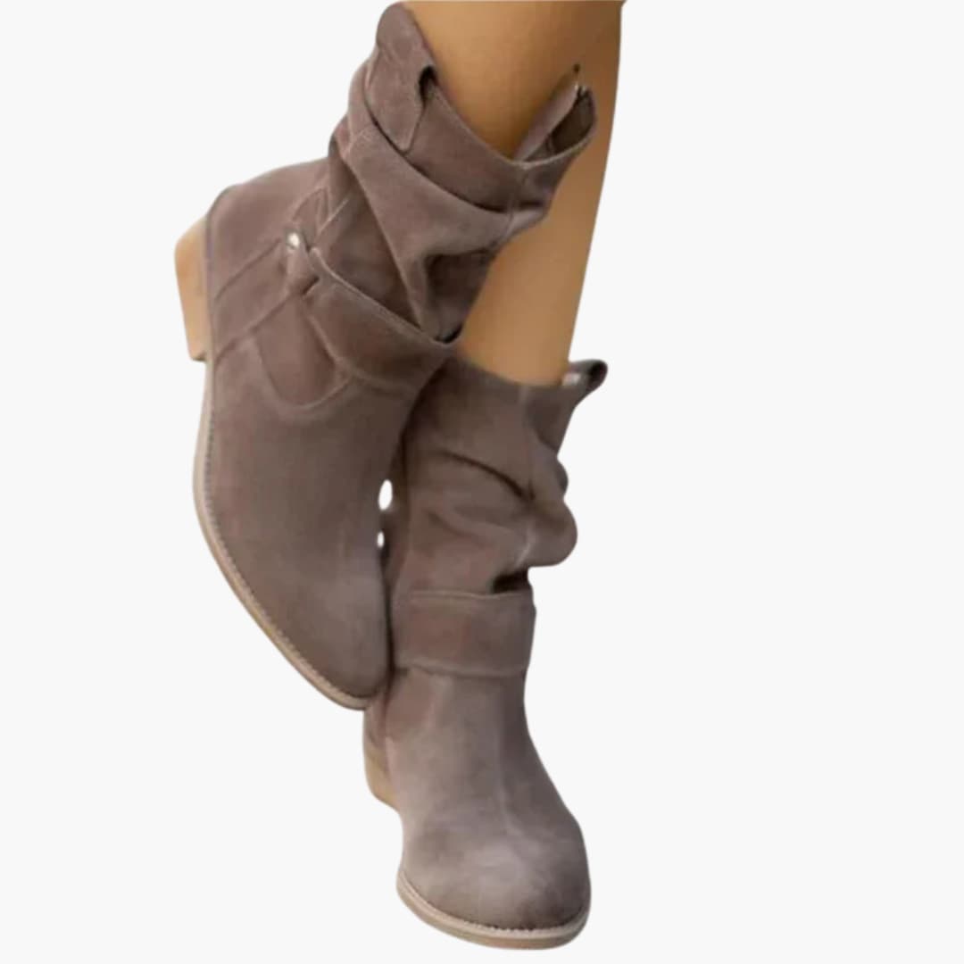 Women's black ankle boots with side zipper and metal rivet strap detail for everyday style