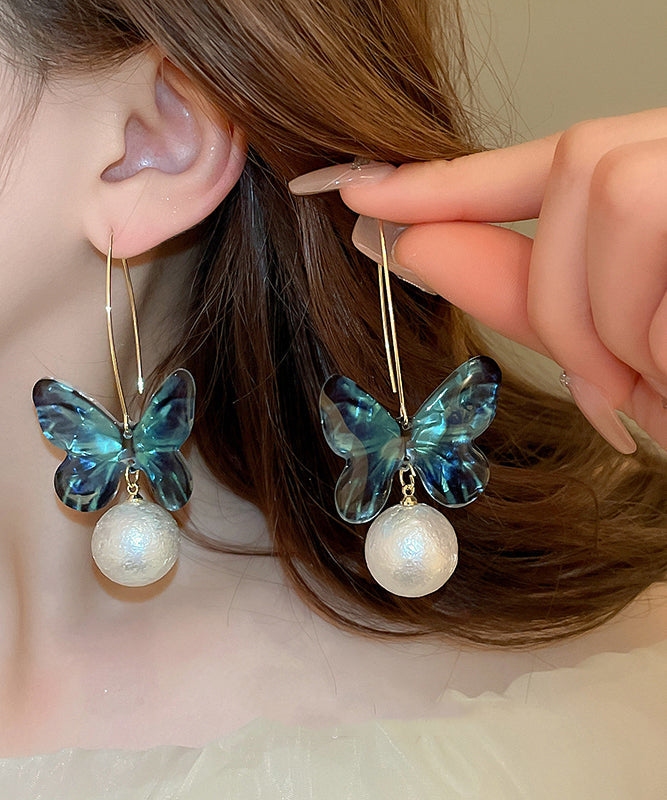 Boucles d'oreilles créoles en acrylique bleu avec perles et papillon - Urbann-Vibe