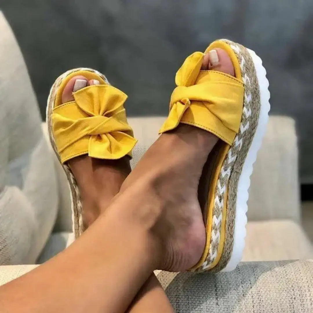 Women's beige braided wedge sandals with oversized bowknot detail, peep toe, and cushioned espadrille sole