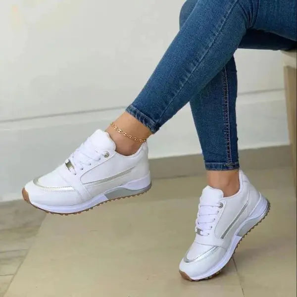 Women's white breathable lace-up sneakers with cushioned sole for all-day comfort and casual style