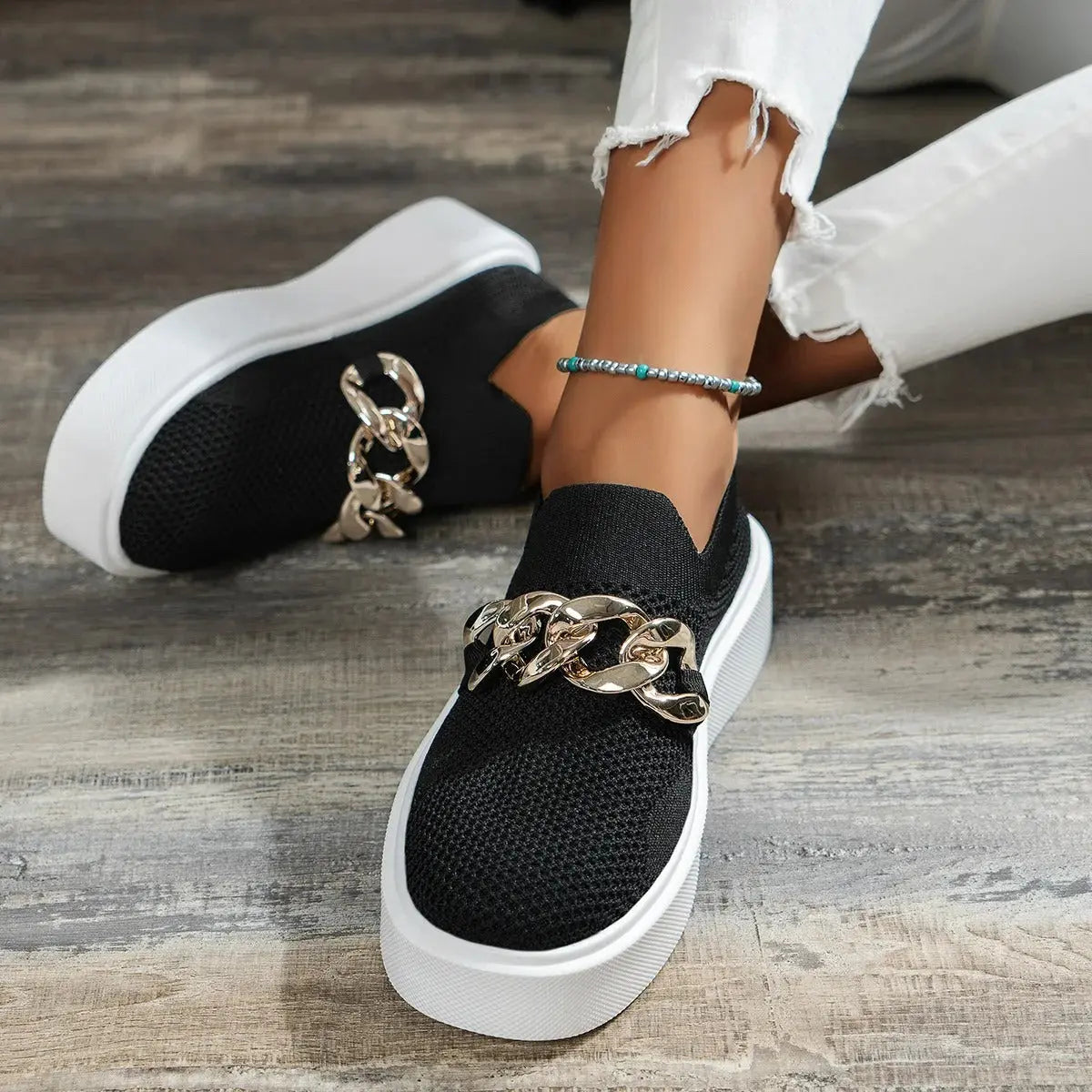 Women's white slip-on platform sneakers with breathable knit upper and chunky chain detail