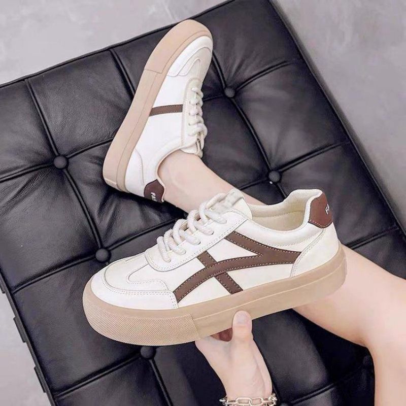 Women's white breathable lace-up sneakers with chunky rubber sole for all-day comfort