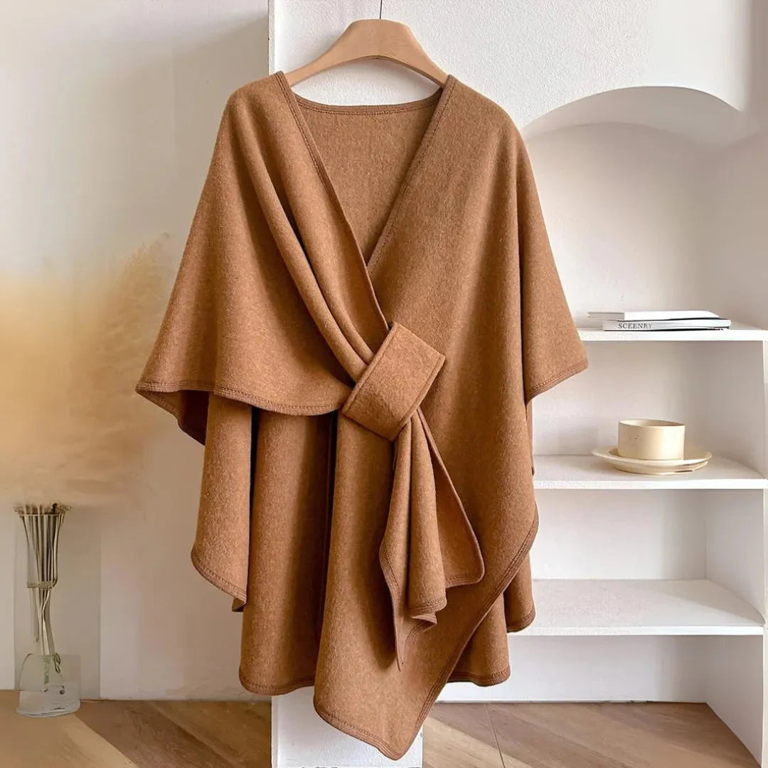 Women's gray fleece knit cape with belted waist, relaxed drape, and functional side pockets