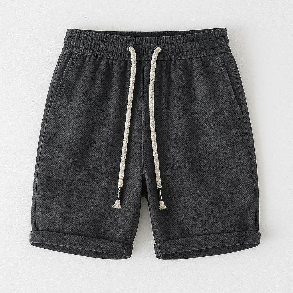 Washed knit unisex shorts in faded vintage tones with elastic drawstring waistband and rolled hem