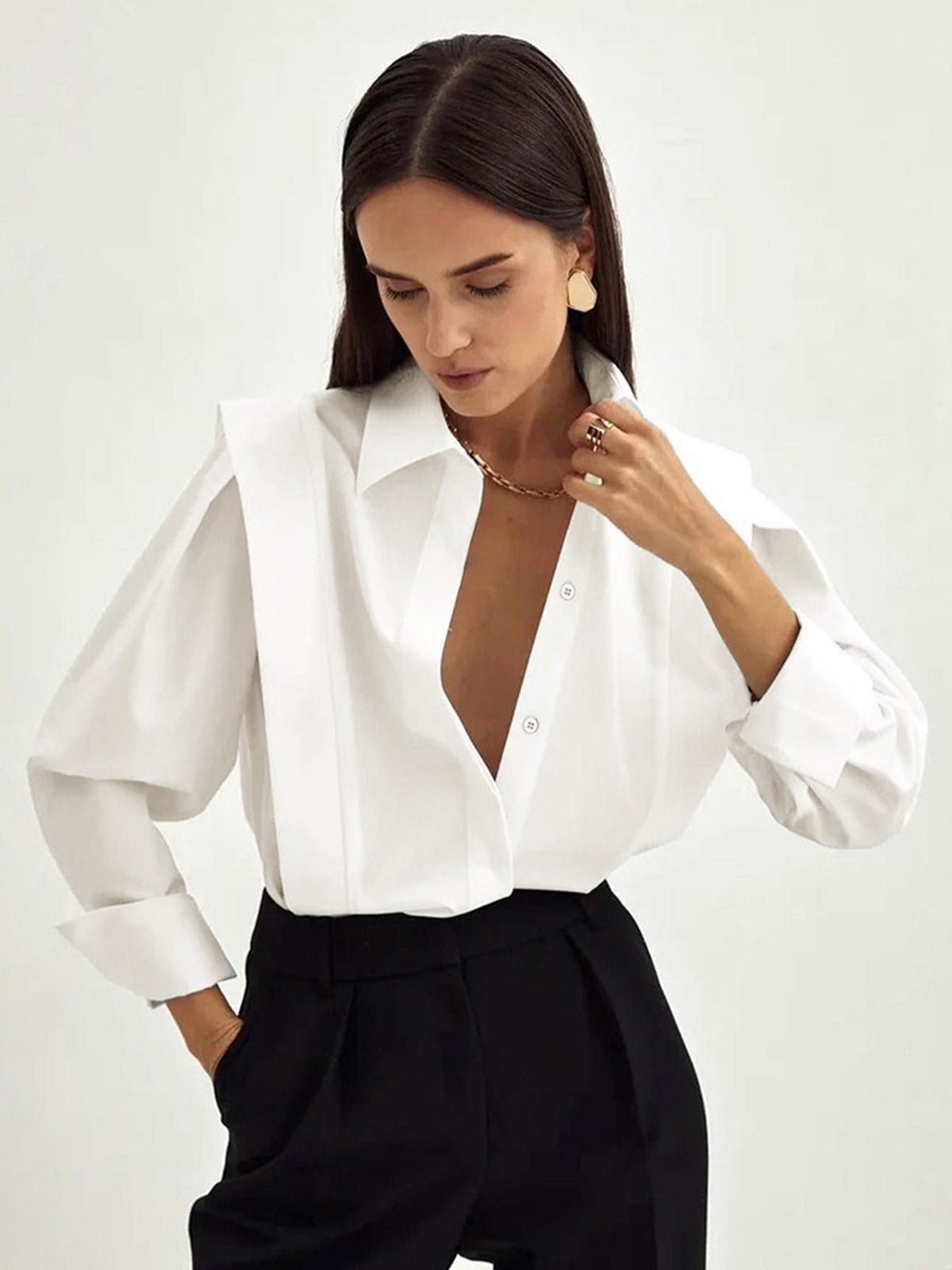 White cotton button-down shirt structured silhouette wide cuffs professional tailored square cut