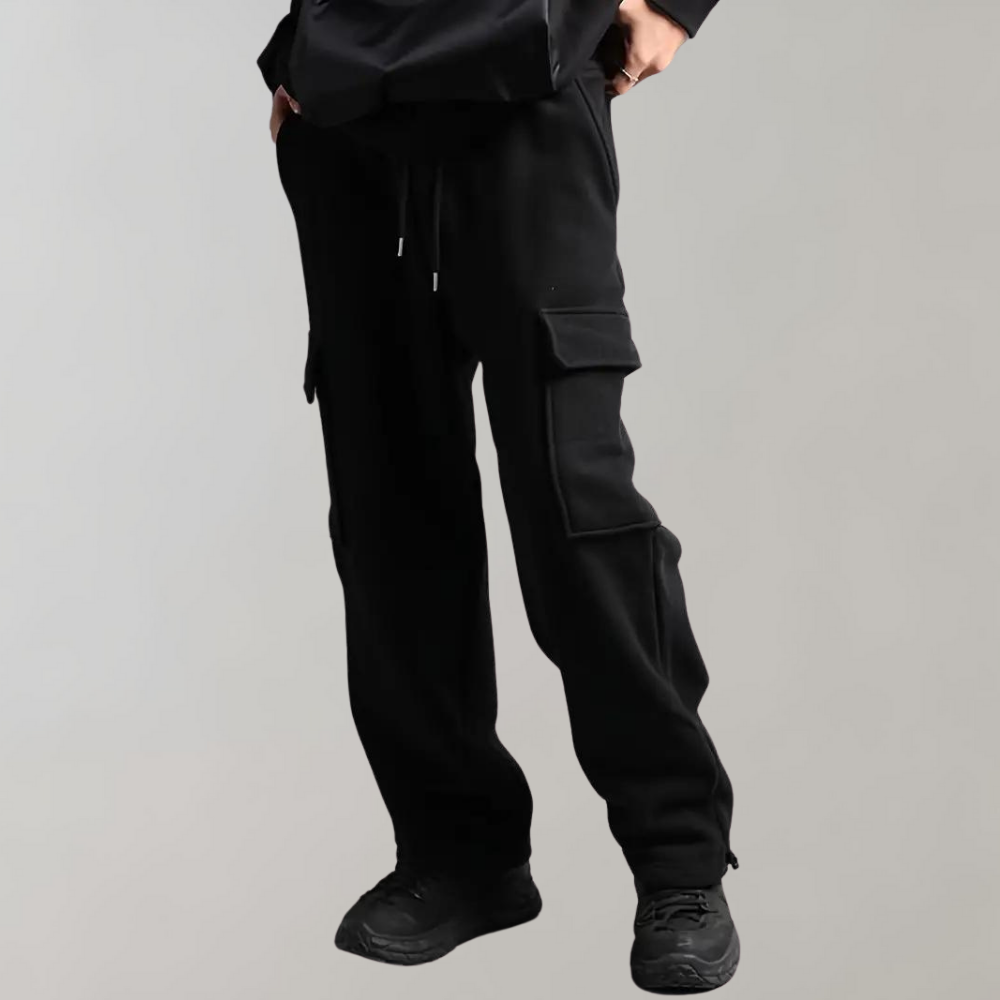 Men's relaxed fit cargo pants in neutral tones with multiple utility pockets for outdoor wear