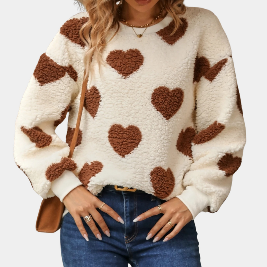 Women's cozy knit jumper in soft neutral tones, relaxed everyday fit with sustainable fabric construction