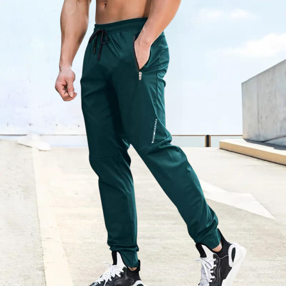 Men's slim fit jogger pants with elastic drawstring waist, zipper pockets, breathable athletic design