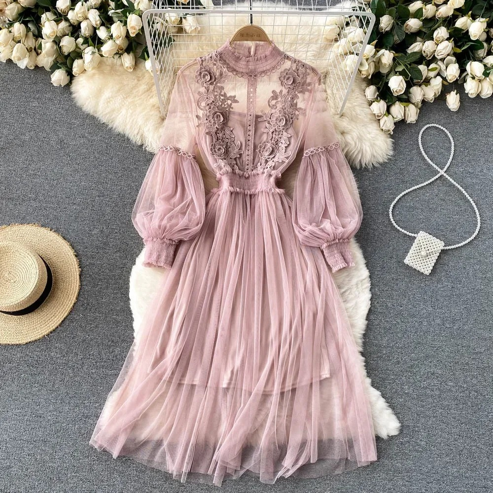 White lace embroidered high collar dress with long puff sleeves and flowing tulle skirt
