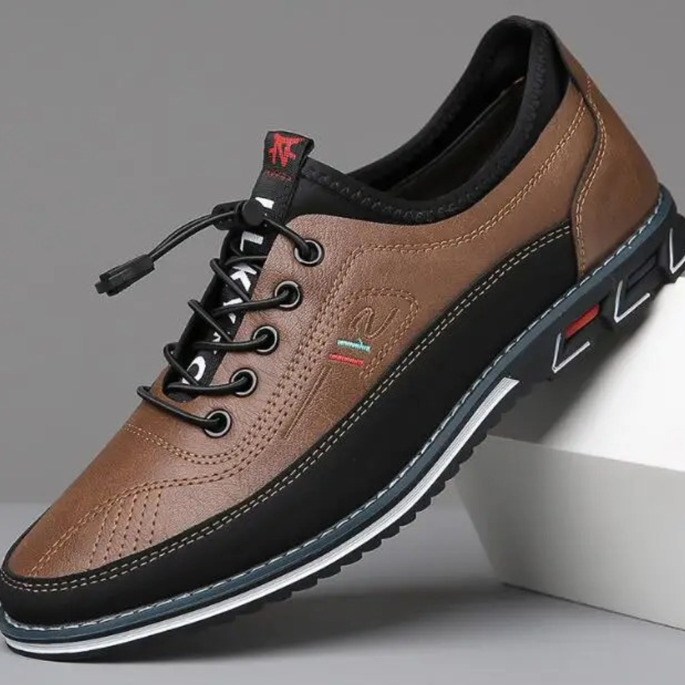 Men's low-profile white leather sneakers with sleek silhouette and shock-absorbing sole
