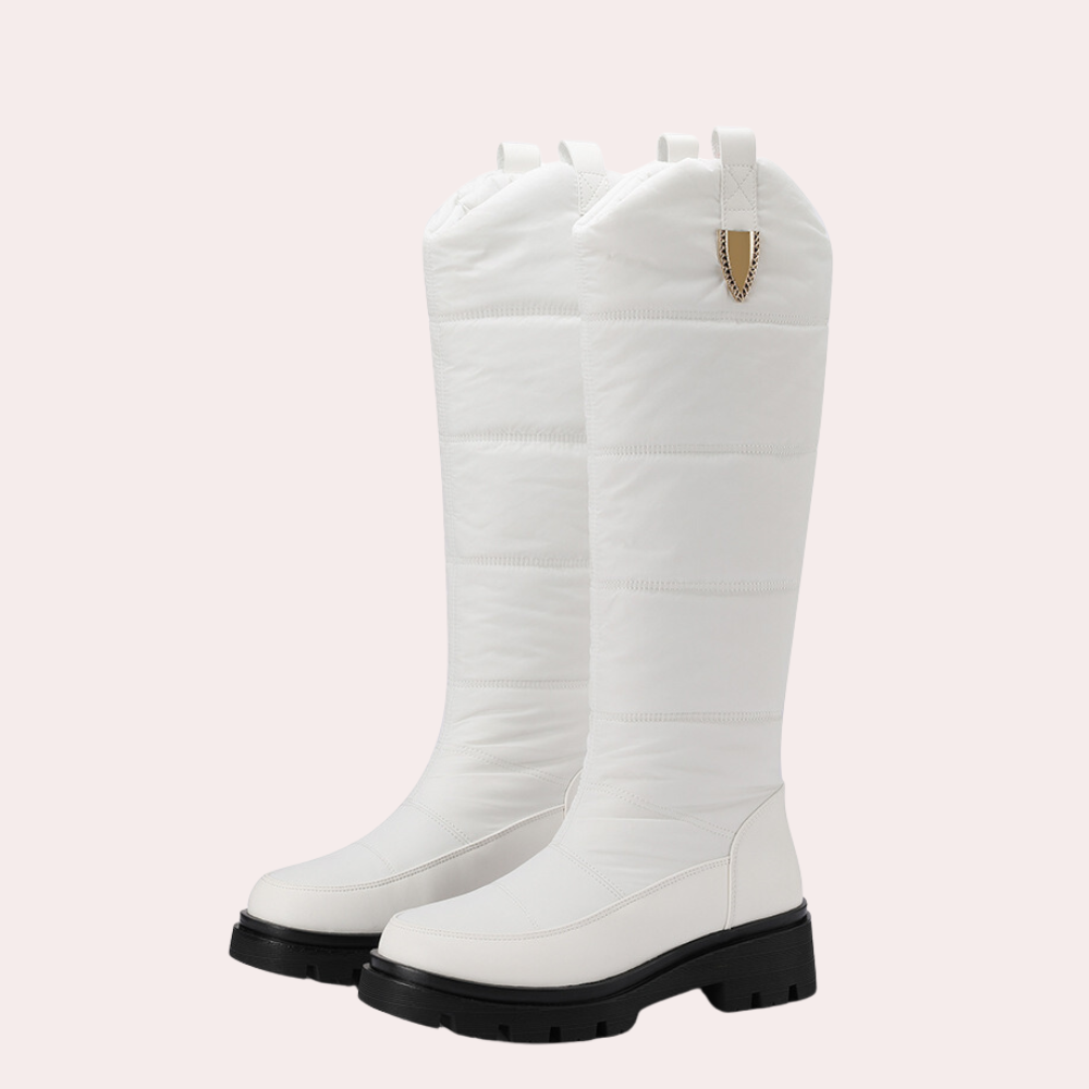 Women's knee-high PU leather boots with quilted shaft, rugged sole, sleek black finish for fall winter
