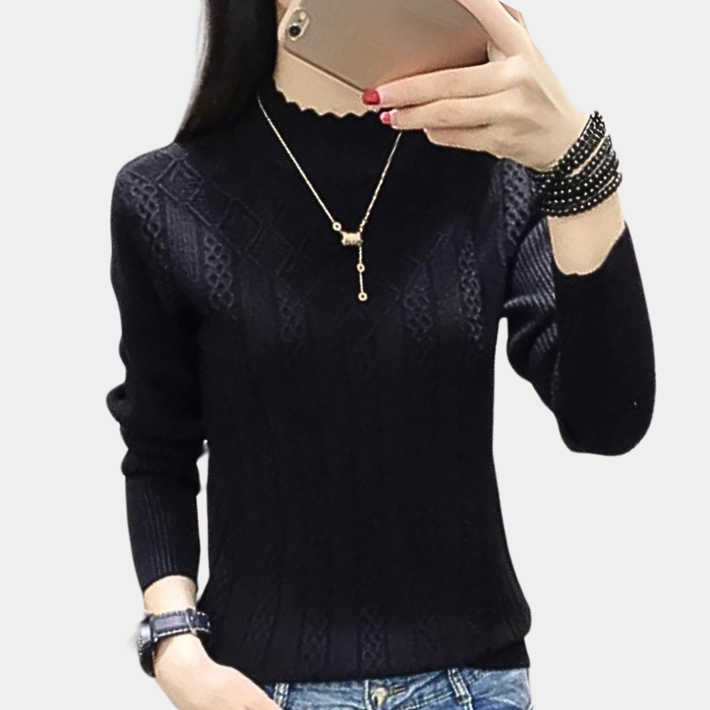 Women's soft knit turtleneck sweater in cozy winter style with elegant drape and sustainable fabric