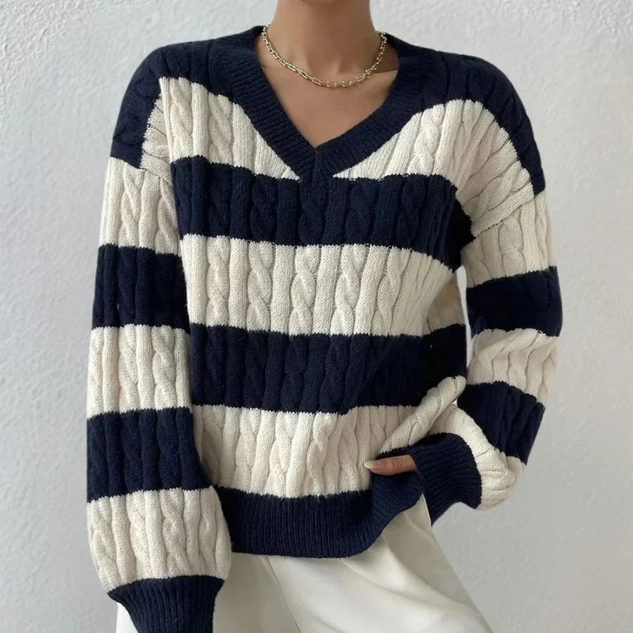Women's cream cable knit jumper V-neck silhouette with classic textured pattern, cozy elegant fit