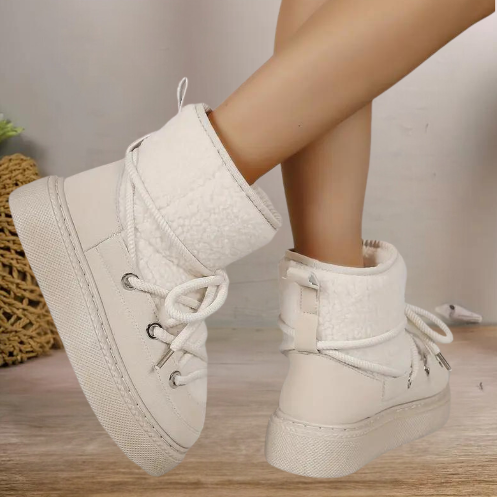 Women's insulated snow boots in neutral tones, featuring waterproof construction for cold weather comfort