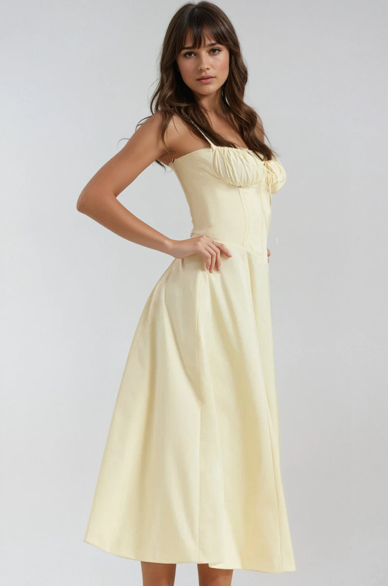 Black corset midi dress with structured bodice, flared skirt, and romantic feminine silhouette
