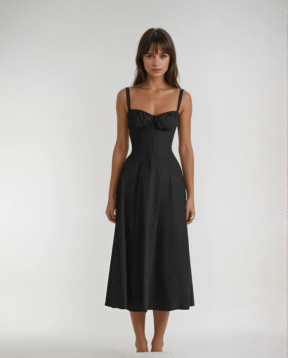 Black corset midi dress with structured bodice, flared skirt, and romantic party-ready silhouette