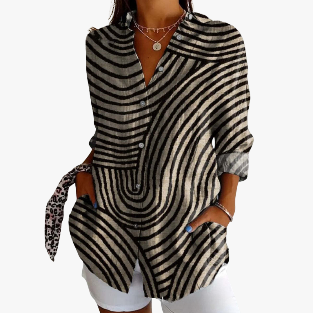 Women's white linen blouse with handcrafted embroidery, relaxed fit, timeless artisanal style