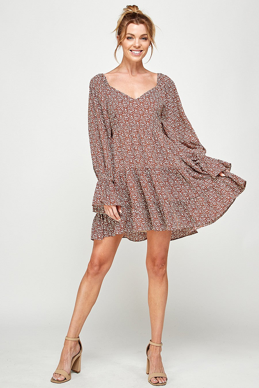 Black printed long sleeve mini dress with alluring pattern, above-knee length for effortless style