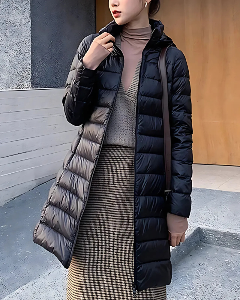 Women's mid-length slim fit quilted puffer jacket with hood, insulated winter coat flattering silhouette