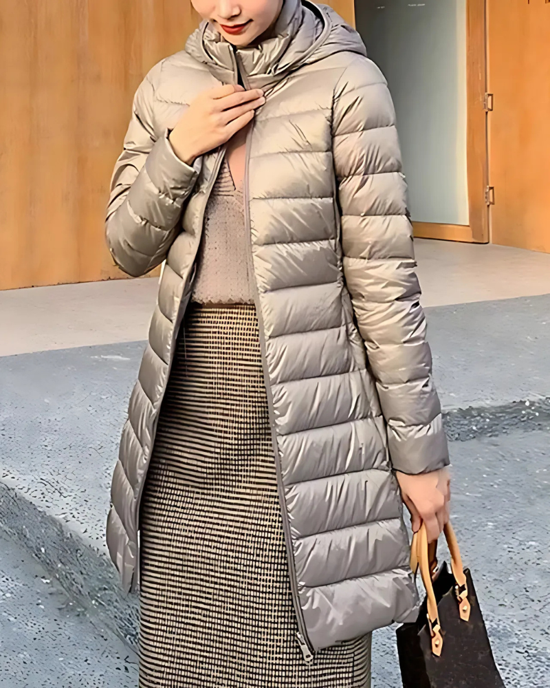 Women's slim fit mid-length hooded quilted puffer jacket with flattering insulated silhouette