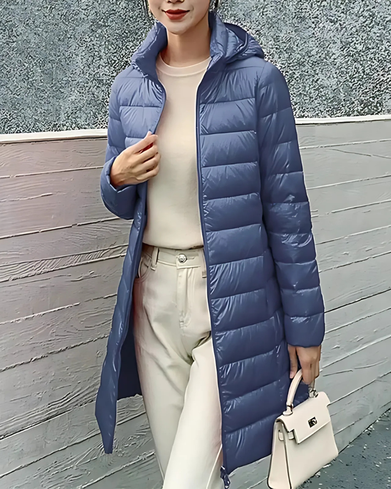Women's slim fit mid-length quilted puffer jacket with hood, insulated for winter warmth