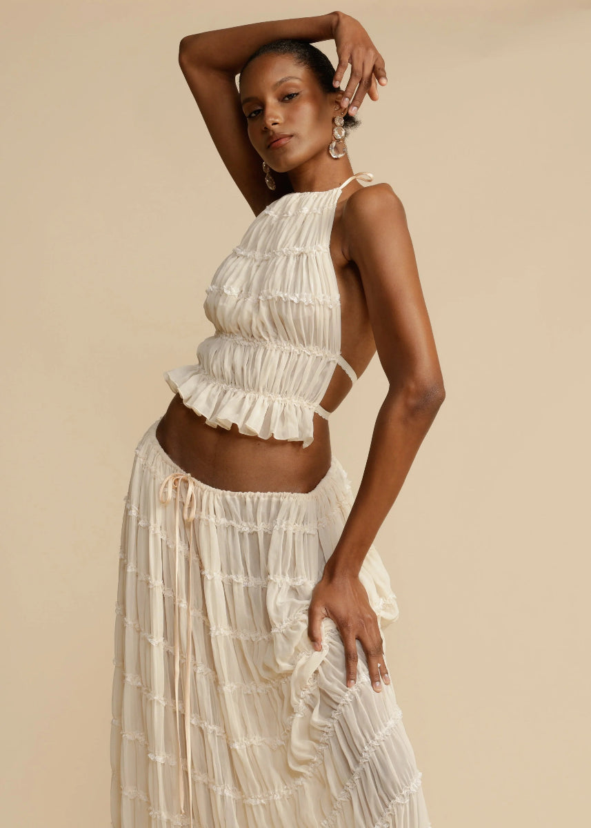 Women's two-piece halter top maxi skirt summer set with ruffled neckline and flowing silhouette