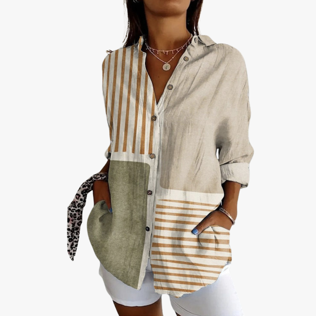 Women's white linen blouse with handcrafted embroidery, relaxed fit and timeless artisanal elegance