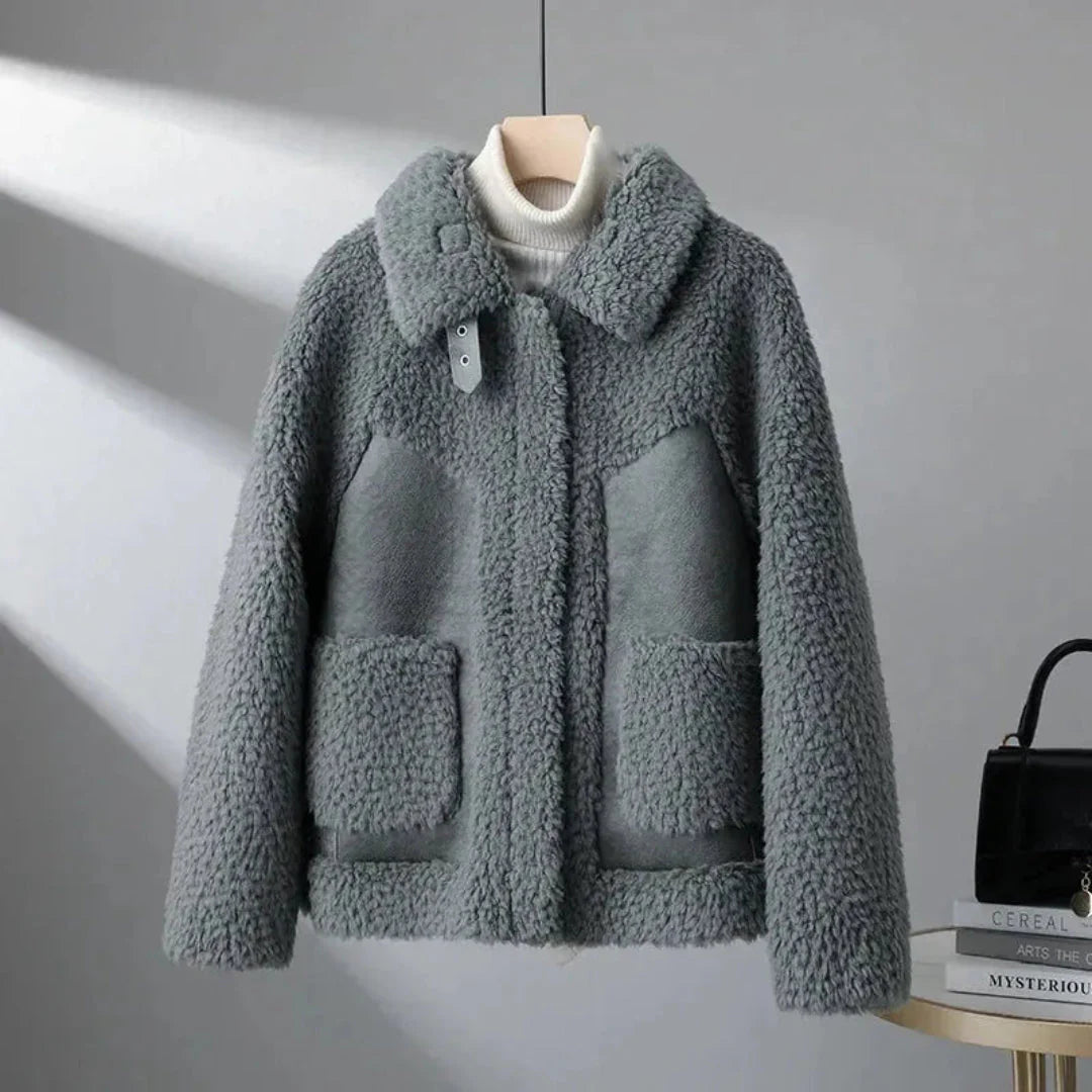 Camel lambswool overcoat with plush granular texture, tailored silhouette, and refined collar detail