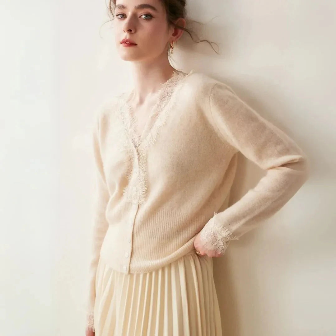 Women's ivory cashmere cardigan with delicate lace trim, V-neck, and button closure for refined feminine style