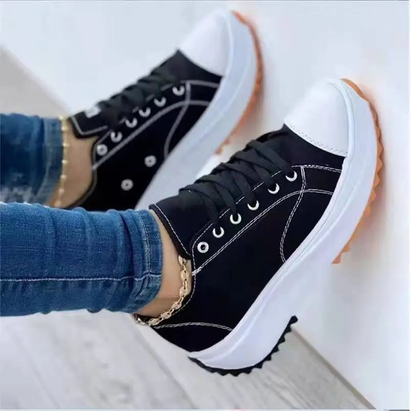 Women's white canvas low-top platform sneakers with thick cushioned sole for all-day comfort