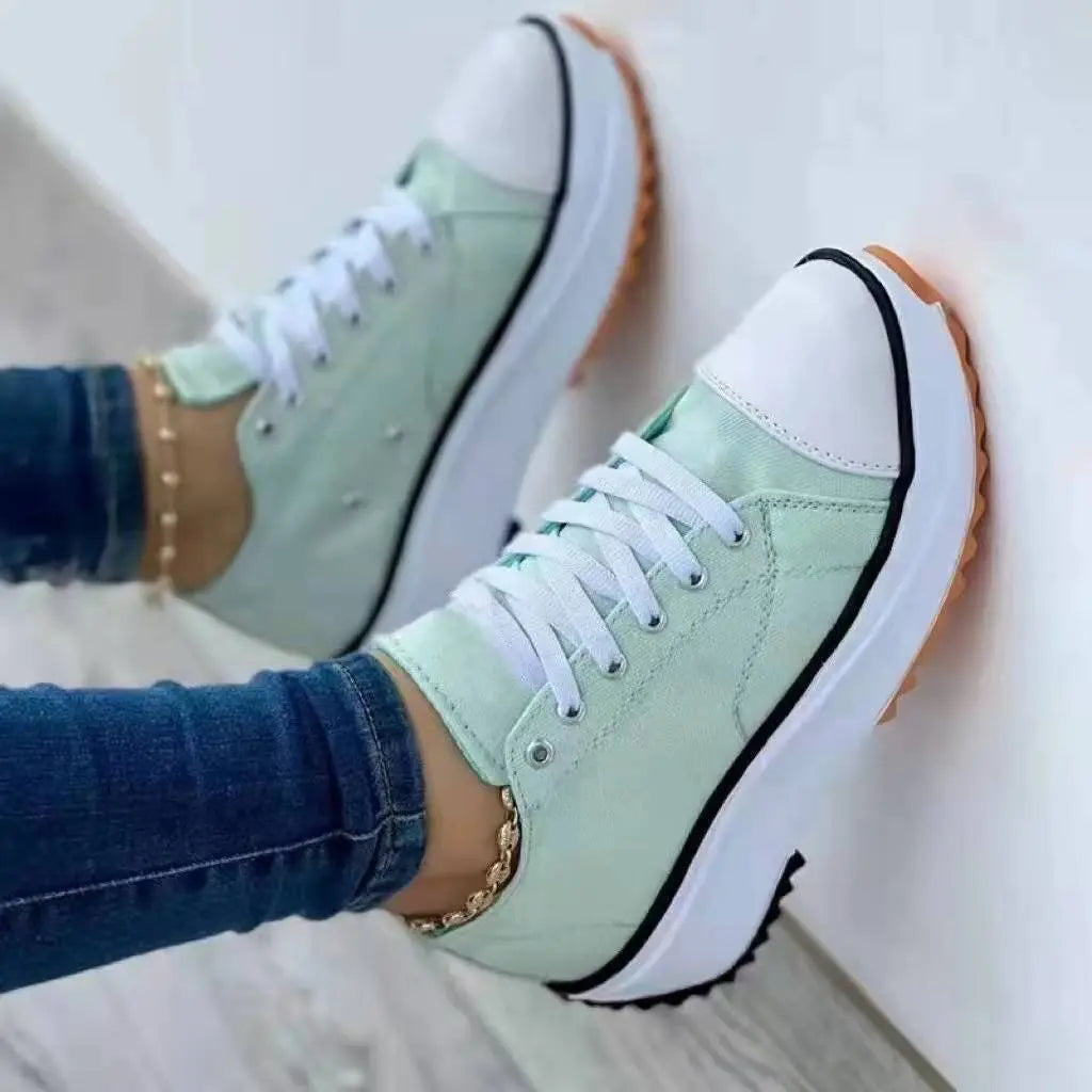 Women's white canvas low-top platform sneakers with thick cushioned sole for all-day comfort